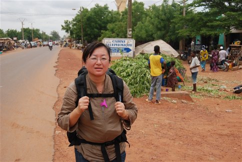 Chika Motel walking in the heat of Segou, Mali